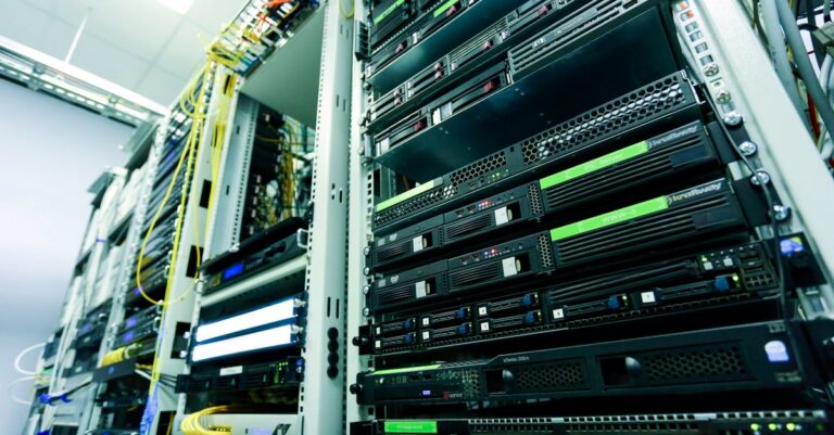 High-tech server rack in a secure data center with network cables and hardware components.