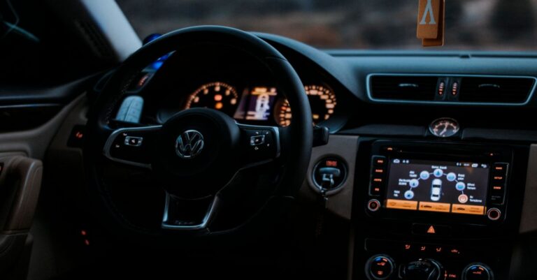 Cozy Volkswagen car interior showing dashboard display and steering wheel.