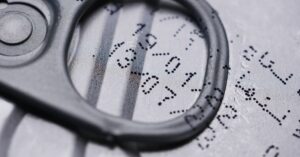 Detailed image of a drink can lid showing printed expiration date.