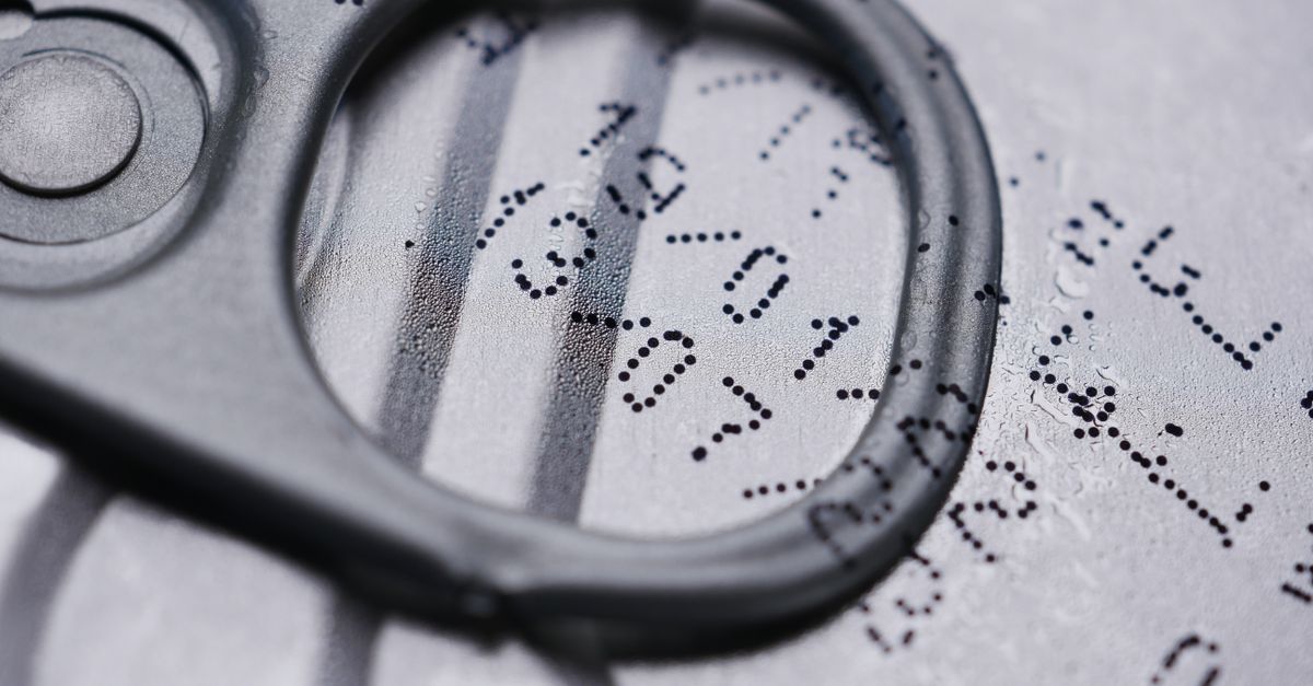 Detailed image of a drink can lid showing printed expiration date.