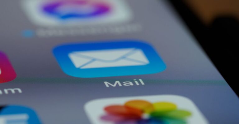 Detailed close-up of an email app icon on a smartphone screen, showcasing modern technology.