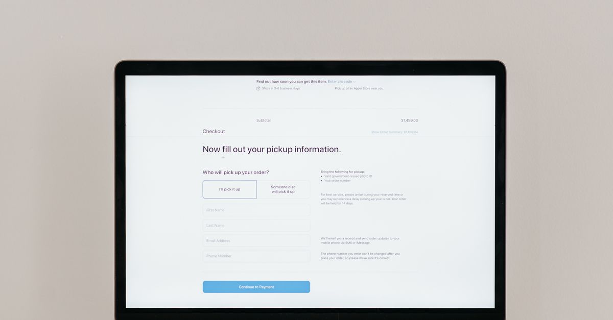 A laptop displaying an online checkout form, highlighting technology and e-commerce.