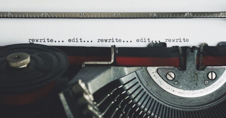 Classic typewriter with text 'rewrite... edit...' on paper.