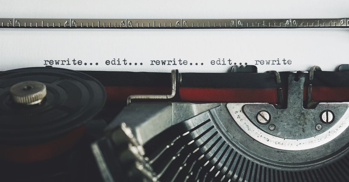 Classic typewriter with text 'rewrite... edit...' on paper.
