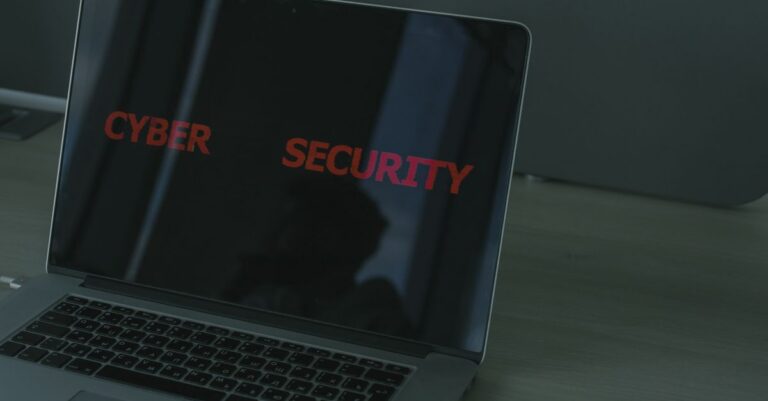 Close-up of a laptop displaying cybersecurity text, emphasizing digital security themes.