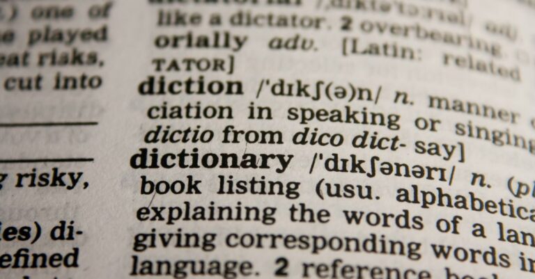 Detailed close-up view of a dictionary page highlighting the word 'dictionary' and its definition.