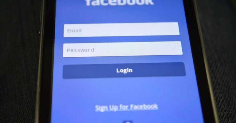 Close-up of a smartphone screen showing the Facebook login interface.