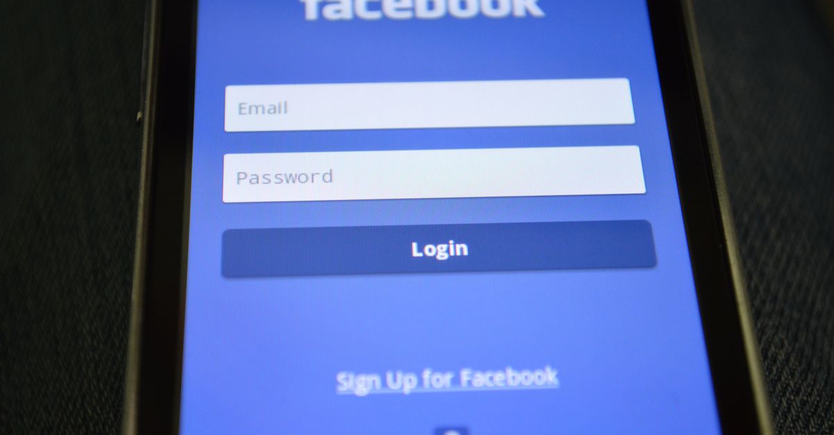 Close-up of a smartphone screen showing the Facebook login interface.
